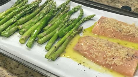 Fresh-salmon-fillets-and-asparagus-marinading,-home-cooking-preparation