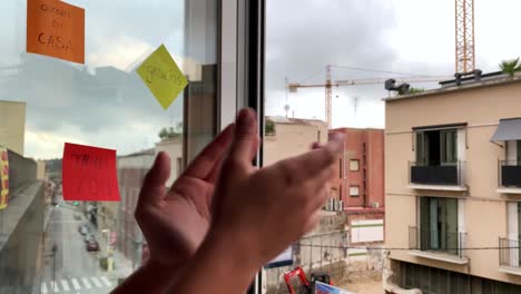 Young-woman-clapping-her-hands-at-a-window