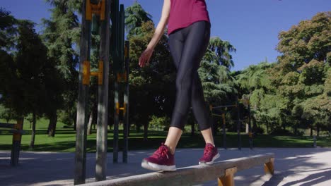 COVID-19-Fitness---Young-Woman-Exercising-Outdoors---Wearing-Face-Mask,-Static-Low-Angle