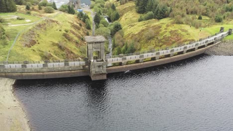 Alwen-reservoir-industrial-hydroelectric-landmark-historical-rural-lake-dam-building-high-angle-aerial-orbit