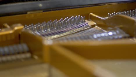 Close-up-of-strings-within-a-concert-grand-piano
