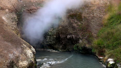 Slow-motion-shot-of-steam-venting-from-Dragon's-Mouth-Spring-in-Yellowstone-National-Park