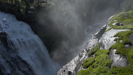 Aerial-view-of-misty-spray-rising-from-crashing-water-of-Rjukan-Falls