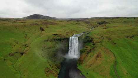 Ascending-over-Skogafoss-waterfall-in-South-Iceland---Ring-Road---Aerial-footage