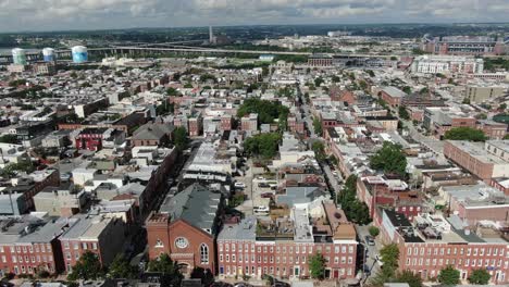Aerial-truck-shot-of-South-Baltimore-Maryland-urban-city-housing-establishing-shot,-Ravens-stadium,-Rt