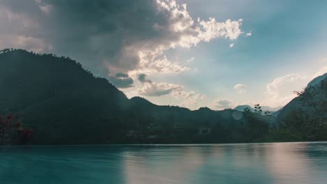 Beautiful-long-exposure-time-lapse-in-an-infinity-pool-in-Lanquin,-Guatemala---clouds,-mountains-and-water