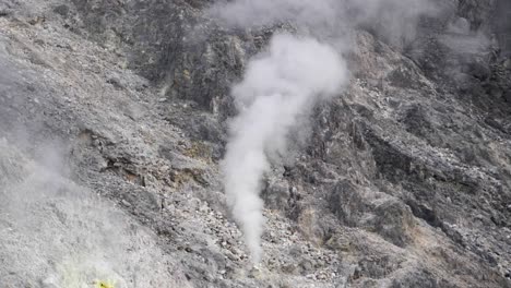 Sulfur-smoke-coming-out-of-volcano-in-North-Sumatra,-Indonesia