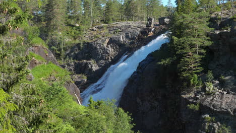 Rjukan-Falls,-or-Rjukanfossen-Waterfall,-in-alpine-forest-of-Norway