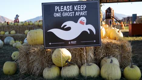 Please-Keep-One-Ghost-Apart-Board-Display-At-The-Entrance-Of-A-Pumpkin-Patch-During-The-Pandemic-Coronavirus-In-Utah,-USA