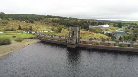 Alwen-reservoir-industrial-hydroelectric-landmark-historical-rural-lake-dam-building-slow-aerial-orbit-left