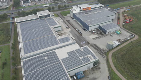 Flying-over-industrial-rooftop-filled-with-solar-panels