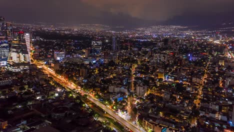 Dramatic-Lightning-Storm-Over-Bustling-Mexico-City,-Aerial-Night-Hyperlapse