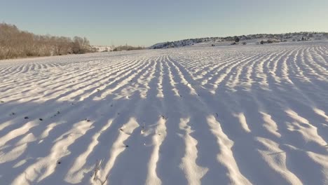 Winter-Aerial-Flyover-Snowy-Field