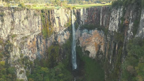 Aerial-view-of-a-big-rock-wall-rainforest-brazilian-waterfall