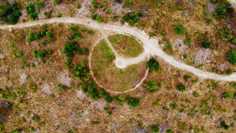 The-old-symbolic-megalithic-stone-landmark-in-a-perfect-circle-in-Leśno,-Chojnice-County-Poland--aerial