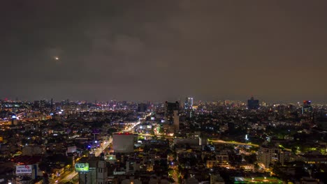 Flying-Hyperlapse-Over-Downtown-Mexico-City-on-Cloudy-Night,-Aerial-Pull-Back