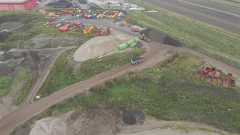 Aerial-of-busy-landfill-with-containers-and-excavators