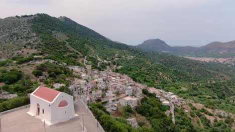 Aerial-view-of-small-church-and-picturesque-village
