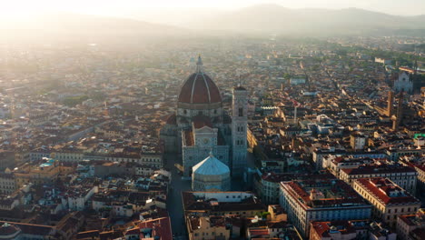 Florence-at-sunrise,-Cathedral-in-center-of-Aerial-shot
