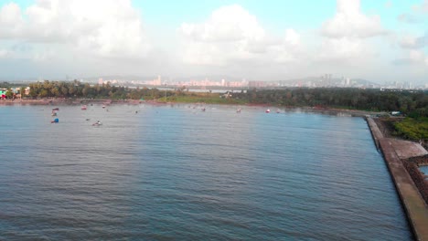 gorai-beach-dock-and-cost-fishing-boat-waves-on-sun-set-dron-shot-birds-panorama-view