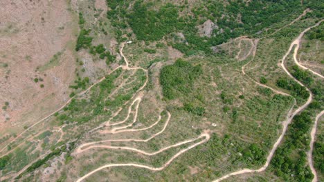 Aerial-over-the-mountains-with-numerous-zig-zag-trekking-trails-over-them