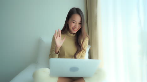Busy-asian-corporate-making-time-for-family-on-video-call