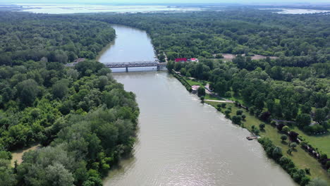Left-to-right-drone-shot-from-a-bridge-crossing-the-river-Tisza-in-Hungary