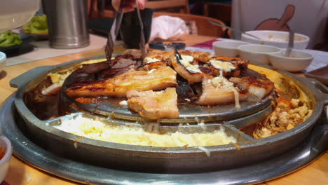 Korean-hot-plate-barbeque-with-various-cuts-of-meat-and-melting-cheese