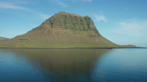 Low-level-aerial-pull-out-of-Kirkjufell-mountain-in-Iceland
