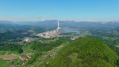 Aerial-distinct-mesmerizing-green-city-Velenje,-Slovenia,-Europe,-thermoelectric-plant