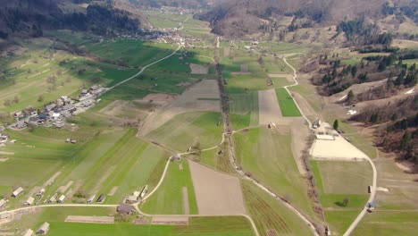 Aerial-View-Over-Valley-Meadow-Fields-Near-Lake-Bohinj