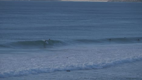 Surfers-riding-the-waves---Gold-Coast-QLD-Currumbin-Australia---Summer-time