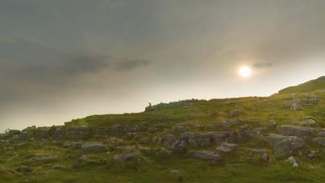 Time-lapse-of-hikers-on-the-Yorkshire-Dales,-England-with-setting-sun