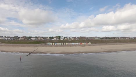 erial-Drone-Footage-of-the-Beautiful-Beach-Huts-on-the-coast-of-Gorleston-On-Sea,-Norfolk