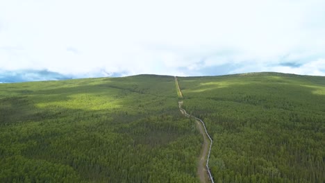 Industrial-oil-pipeline-running-through-vast-landscape-in-Alaska