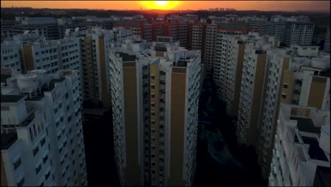 High-rise-Apartments-In-Choa-Chu-Kang,-Singapore-On-A-Brilliant-Sunrise---aerial-drone