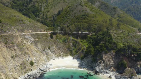 Drone-Descends-to-Reveal-Panoramic-View-of-Famous-McWay-Falls-in-Julia-Pfeiffer-State-Park-along-Highway-1,-California,-USA