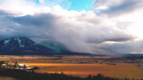 Snow-squall-over-Montana-yellow-fields---Rocky-Mountains,-time-lapse
