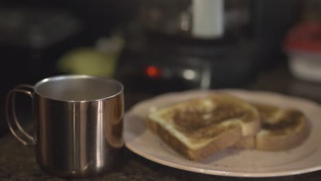 Hot-Cofee-Drink-On-Metal-Cup-With-Toasted-Bread-On-A-Plate