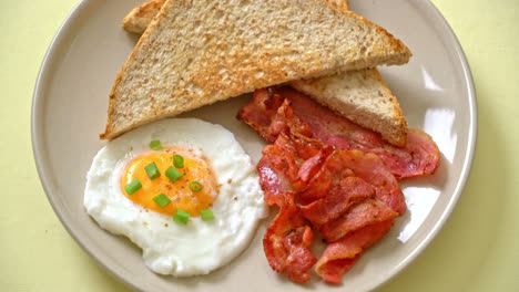 fried-egg-with-bread-toasted-and-bacon-for-breakfast
