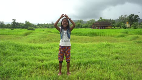 little-girl-dancing--near-temple--farm-malvan-maharashtra