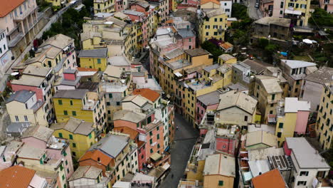 Aerial-fly-over-streets-of-Riomaggiore,-Cinque-Terre-Italy