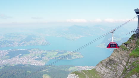 Aerial-cableway-with-scenic-lake-in-background,-Pilatus,-Switzerland