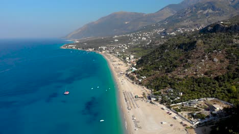 Beach-resorts-and-touristic-villages-on-beautiful-coastline-of-Ionian-sea,-summer-vacation-in-Albania