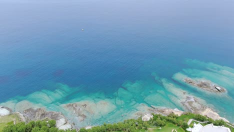 Aerial-forward-over-luxury-seaside-houses-on-Crete-coast-in-Greece