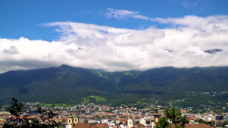 Cityscape-View-of-Innsbruck-with-Cloudy-Mountain-Panorama-in-Summer