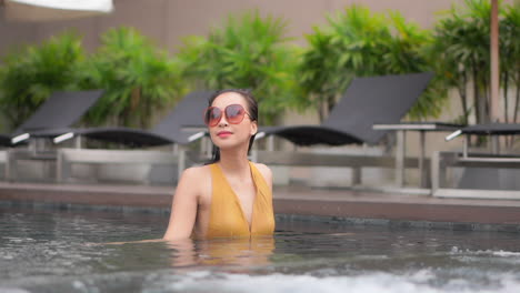 Super-rich-asian-exotic-model-posing-at-pool