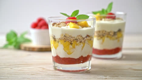 homemade-fresh-mango-and-fresh-raspberry-with-yogurt-and-granola---healthy-food-style