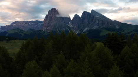 Alpe-di-Siusi,-Dolomites-Aerial-Reveal-flying-over-Forest