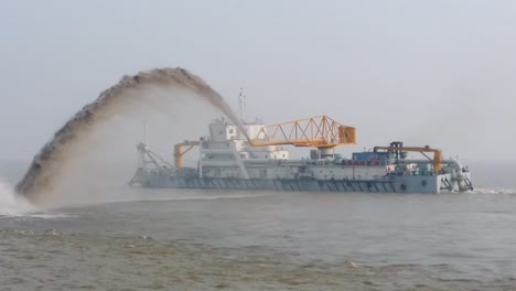 Dredging-Vessel-in-action-to-keep-waterways-navigable,-excavate-and-gathering-sediments-in-the-bottom-and-disposing-at-another-location,-Shanghai-river,-China